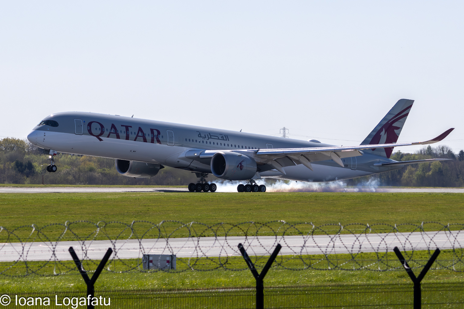 Flying high over the runway in bright sunshine